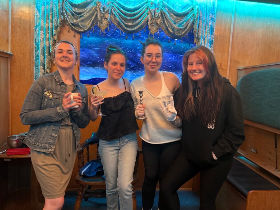 Group celebrating a win in the Loco Motives train car