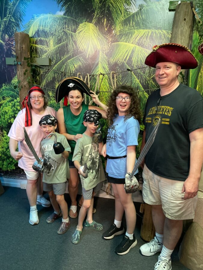 Family with kids dressed as pirates